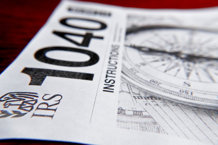 This photo made on Wednesday, Feb. 13, 2019, in Zelienople, Pa., shows 1040 tax forms instructions printed from the Internal Revenue Service web page that are used for 2018 U.S. federal tax returns. 