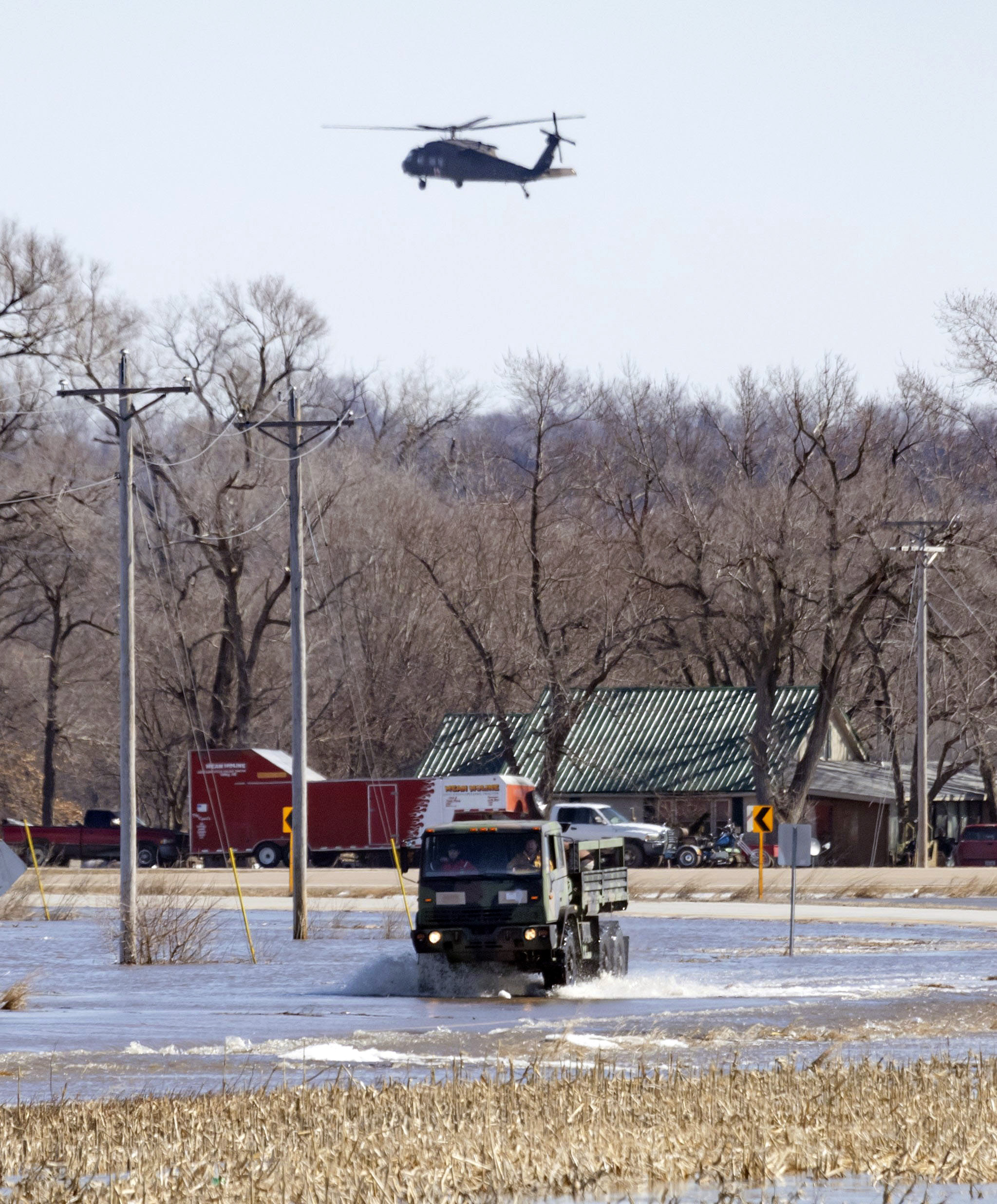 First responders bring out a truckload of residents from the King Lake area near Valley, Neb. because of flooding on Friday, March 15, 2019. Flooding in the central U.S. on Friday caused by rain and snowmelt from a massive late-winter storm forced hundreds of people to evacuate, threatened a nuclear power plant and shut down traffic on part of the Missouri River, foreshadowing a difficult spring flooding season. 