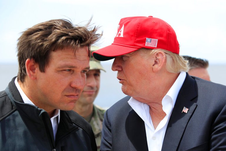 President Donald Trump talks to Florida Gov. Ron DeSantis during a visit to Lake Okeechobee and Herbert Hoover Dike at Canal Point, Florida, Friday, March 29, 2019.
