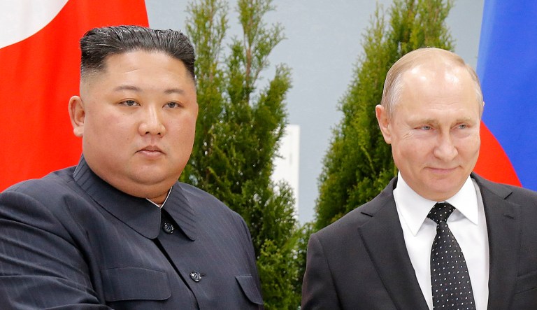 Russian President Vladimir Putin, right, and North Korea's leader Kim Jong Un shake hands during their meeting in Vladivostok, Russia in 2019, while the two leaders may be meeting in-person this week for the first time since then.