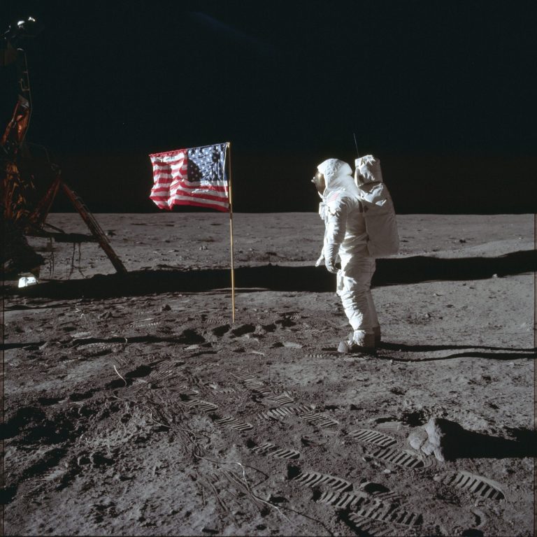 In this July 20, 1969 photo made available by NASA, astronaut Buzz Aldrin Jr. poses for a photograph beside the U.S. flag on the moon.