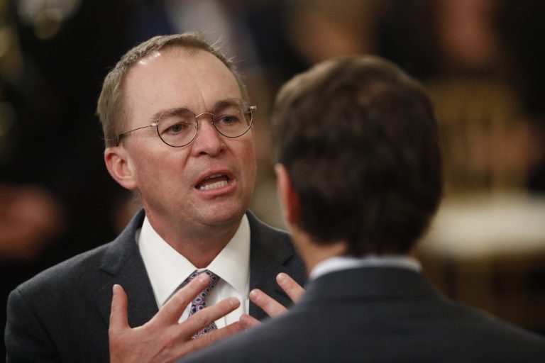 White House acting chief of staff Mick Mulvaney mingles with other attendees in the in the East Room of the the White House in Washington, Thursday, Feb. 6, 2020, before President Donald Trump arrives to speak.