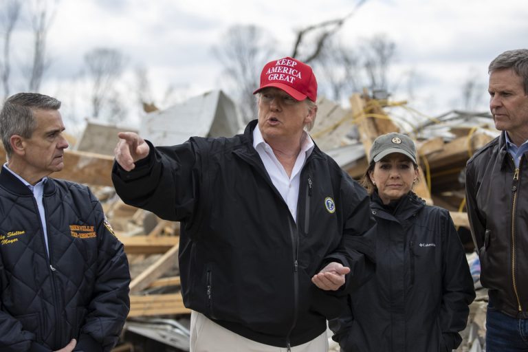 President Donald Trump speaks accompanied by from left, Cookeville Mayor Ricky Shelton, Tennessee first lady Maria Lee, and Gov. Bill Lee, R-Tenn., tour damage from a recent tornado, Friday  in Cookeville, Tenn. 