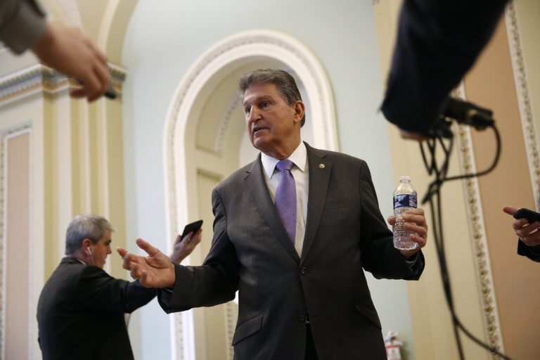 Sen. Joe Manchin, D-W.Va., speaks with reporters on Capitol Hill in Washington, Tuesday, March 24, 2020, as the Senate works to pass a coronavirus relief bill. 