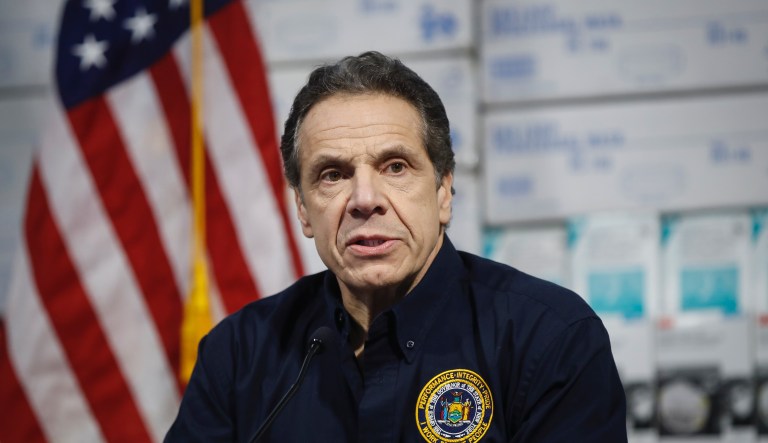 New York Gov. Andrew Cuomo speaks during a news conference against a backdrop of medical supplies at the Jacob Javits Center.