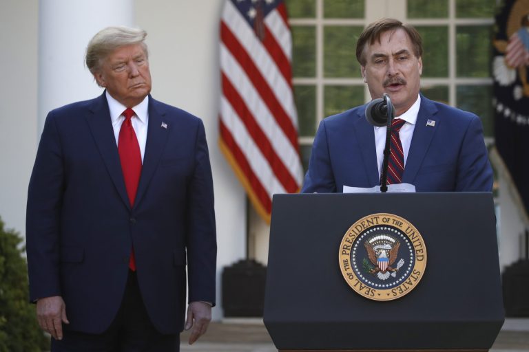 My Pillow CEO Mike Lindell speaks as President Donald Trump listens during a briefing about the coronavirus in the Rose Garden of the White House, Monday. His is one of dozens of companies that have answered the administration's call for help in the crisis.
