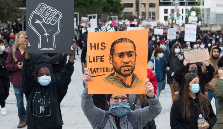 A picture of George Floyd is seen amid protests across the United States over his death after an officer knelt on Floyd's neck for several minutes.