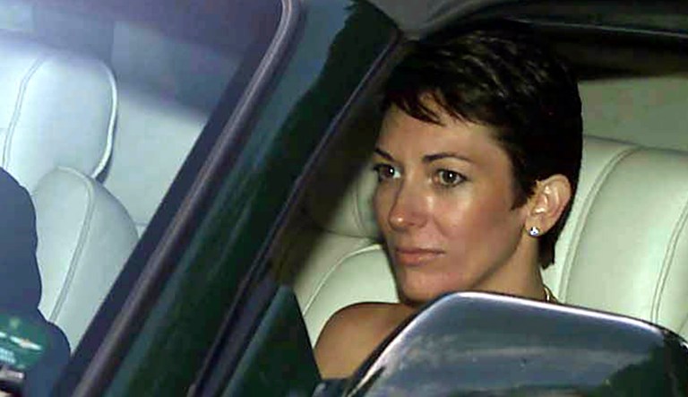 In this Sept. 2, 2000, file photo, British socialite Ghislaine Maxwell, driven by Britain's Prince Andrew, leaves a wedding.