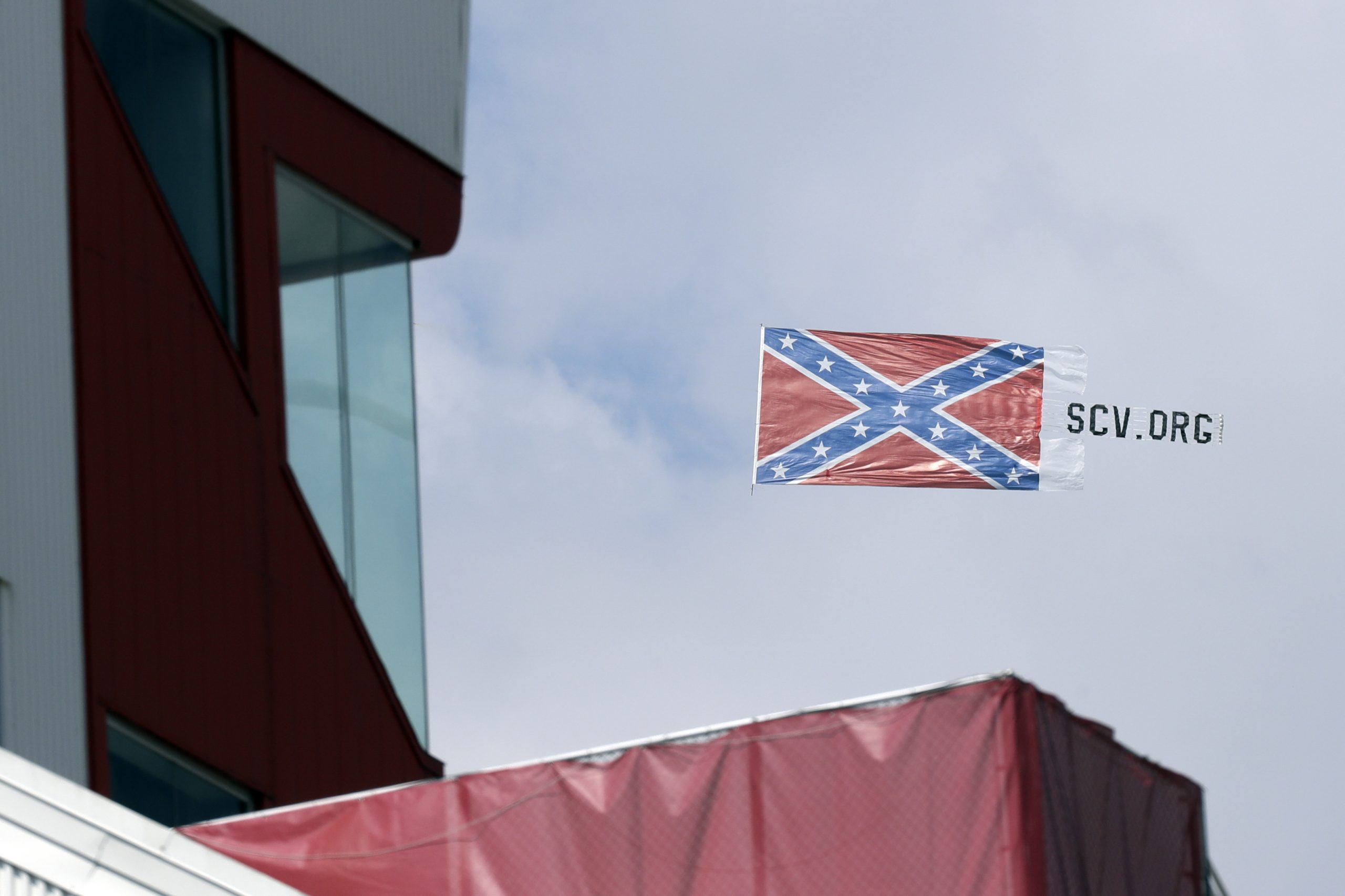 A plane pulls a Confederate battle flag over Bristol Motor Speedway before the NASCAR All-Star auto race in Bristol, Tennessee, on Wednesday.