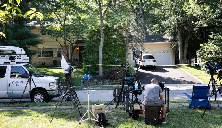 News media is set up in front of the home of U.S. District Judge Esther Salas.