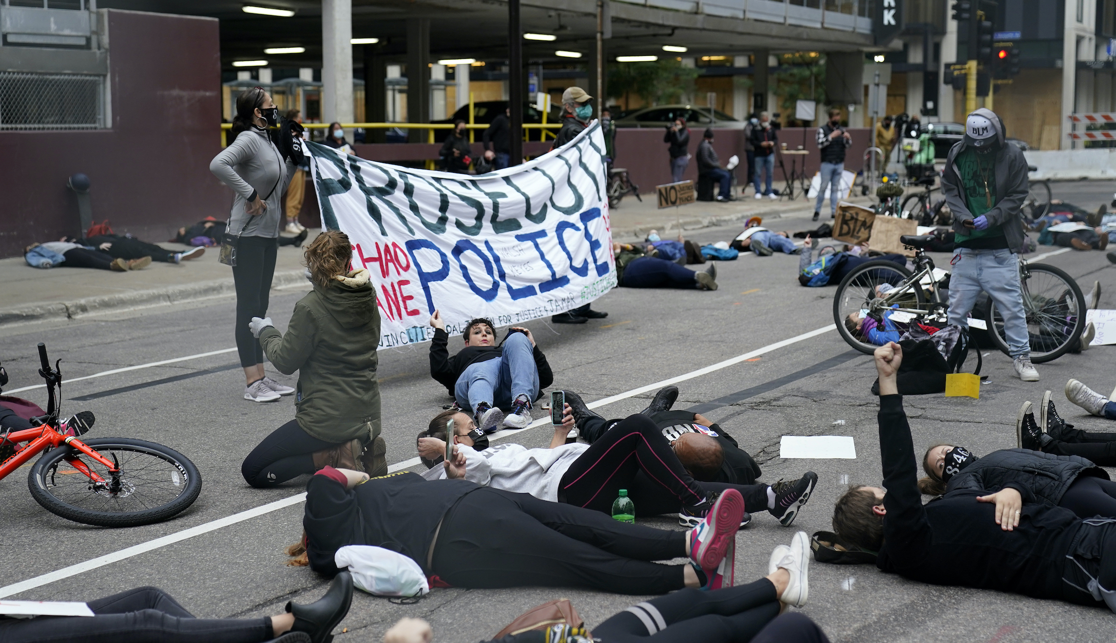 Protesters gather as ex-Minneapolis police officers involved in death of George Floyd appear in court