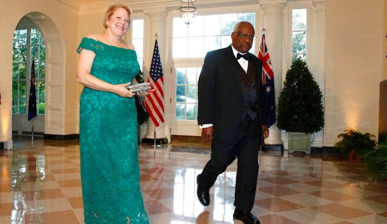 FILE - In this Sept. 20, 2019, file photo, Supreme Court Associate Justice Clarence Thomas, right, and wife Virginia 