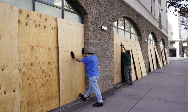 After months of left-wing riots, partisans blame Trump for boarded up storefronts