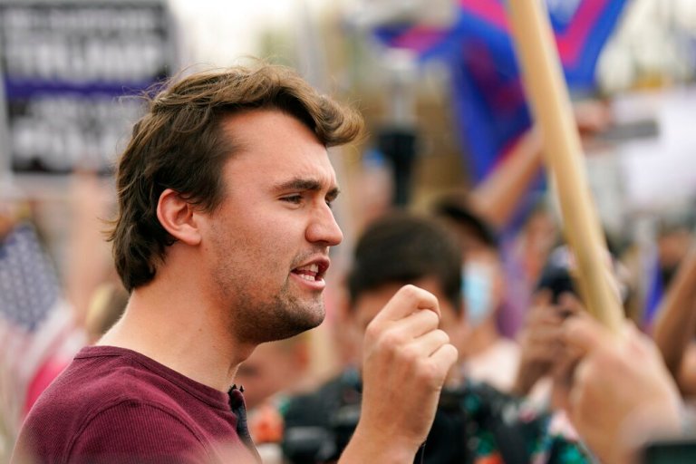 Charlie Kirk, conservative activist and founder of Turning Point USA, speaks to supporters of President Donald Trump at a rally outside the Maricopa County Recorder's Office, Friday, Nov. 6, 2020, in Phoenix.