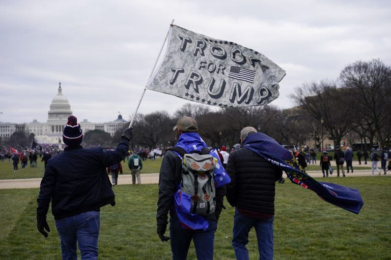 People attend a rally in Washington, Wednesday, Jan. 6, 2021, in support of President Donald Trump. Many rioted in the U.S. Capitol.