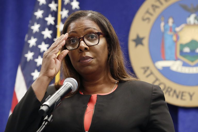 In this Aug. 6, 2020, file photo, New York State Attorney General Letitia James adjusts her glasses as she announces that the state is suing the National Rifle Association during a press conference, in New York. 
