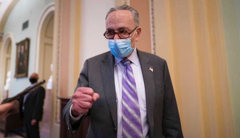 Senate Majority Leader Chuck Schumer, D-N.Y., praises the work of Rep. Jamie Raskin, D-Md., the lead manager in the second impeachment trial of former President Donald Trump at the close of the first day of the proceeding, at the Capitol in Washington, Tuesday, Feb. 9, 2021.