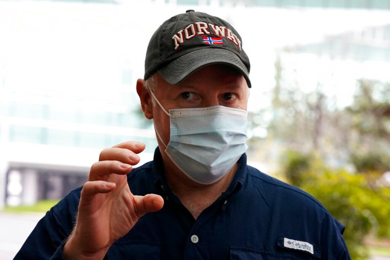 Peter Daszak of the World Health Organization team speaks to journalists before entering the VIP terminal of the airport to leave at the end of the WHO mission in Wuhan in central China's Hubei province on Wednesday, Feb. 10, 2021.