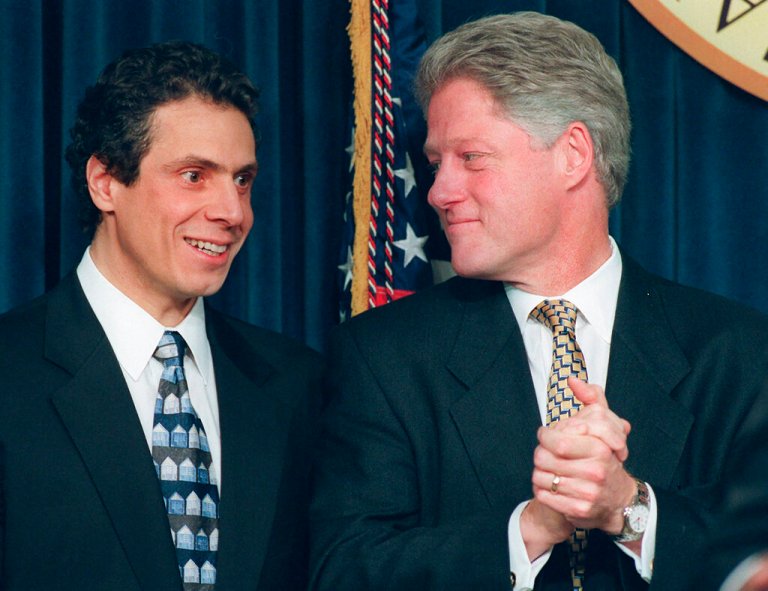 In this Dec. 20, 1996, file photo, Housing Secretary-designate Andrew Cuomo looks on as President Bill Clinton applauds.