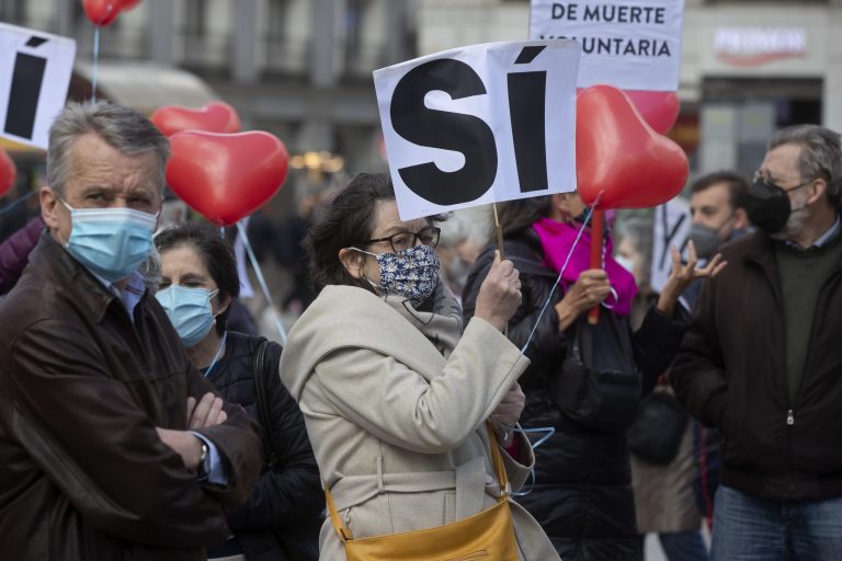 Pro euthanasia protesters demonstrate in Madrid, Spain, Thursday, March 18, 2021. (AP Photo/Paul White)