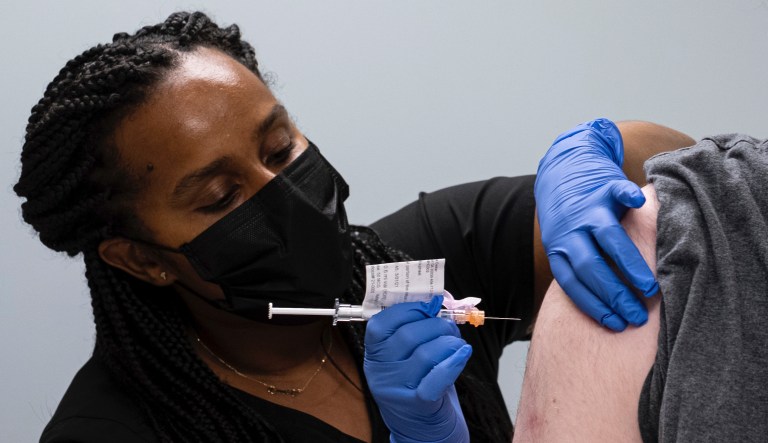 Cole Smith receives a Moderna variant vaccine shot from clinical research nurse Tigisty Girmay on Wednesday afternoon, March 31, 2021 at Emory Universityâs Hope Clinic in Decatur, Ga. Smith was the second person to receive a shot in this new clinical trial.