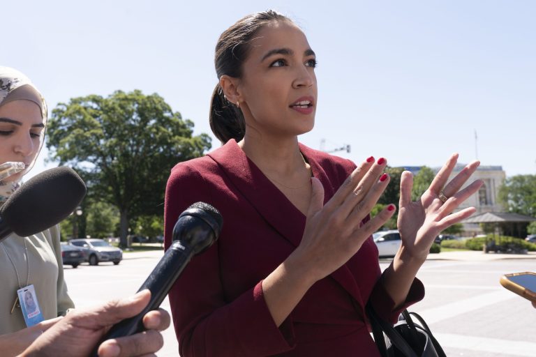 Rep. Alexandria Ocasio-Cortez, D-N.Y., speaks with reporters, Thursday, June 17, 2021, as she arrives on Capitol Hill in Washington.                                                                                                                                                                                             