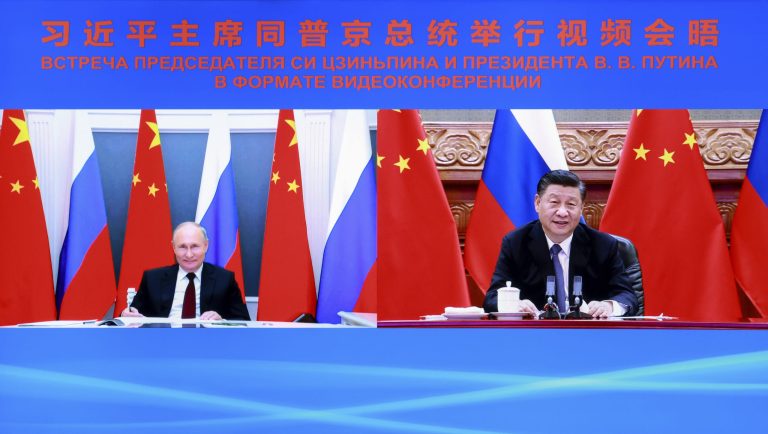 Chinese President Xi Jinping, right, speaks with Russian President Vladimir Putin via video conference in Beijing on June 28. 