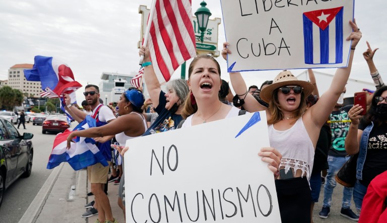 Cuban exiles rally at Versailles Restaurant in Miami's Little Havana neighborhood in support of protesters in Cuba, Monday, July 12, 2021, in Miami. Sunday's protests in Cuba marked some of the biggest displays of antigovernment sentiment in the tightly controlled country in years.