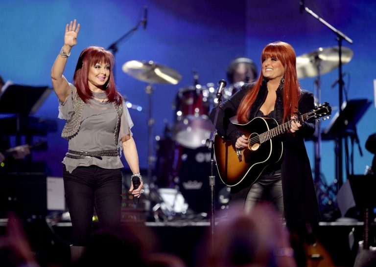 FILE - In this April 4, 2011 file photo, The Judds, Naomi Judd, left, and Wynonna Judd perform at the Girls' Night Out: Superstar Women of Country in Las Vegas. The Grammy-winning duo will be inducted into the Country Music Hall of Fame Sunday, May 1, 2022. Naomi Judd died one day prior, Saturday, April 30, 2022. 