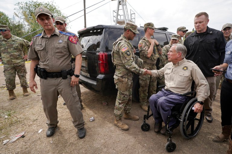Texas Gov. Greg Abbott, right, shakes a National Guard memberâs hand after speaking during a news conference along the Rio Grande, Tuesday, Sept. 21, 2021, in Del Rio, Texas.