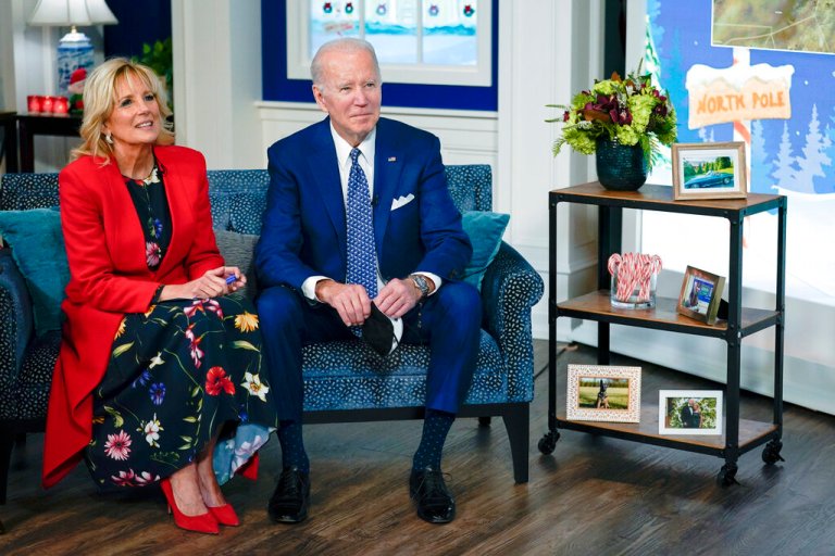 President Joe Biden and first lady Jill Biden speak with the NORAD Tracks Santa Operations Center on Peterson Air Force Base, Colo., via teleconference in the South Court Auditorium on the White House campus in Washington, Friday, Dec. 24, 2021.