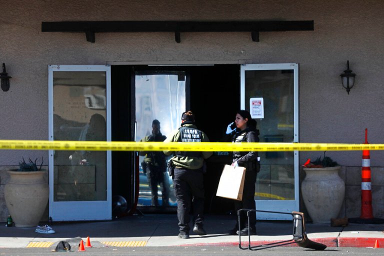 Las Vegas police investigate the scene after a shooting at Manny's Glow Ultra Lounge & Restaurant, Saturday, Feb. 26, 2022, in Las Vegas.