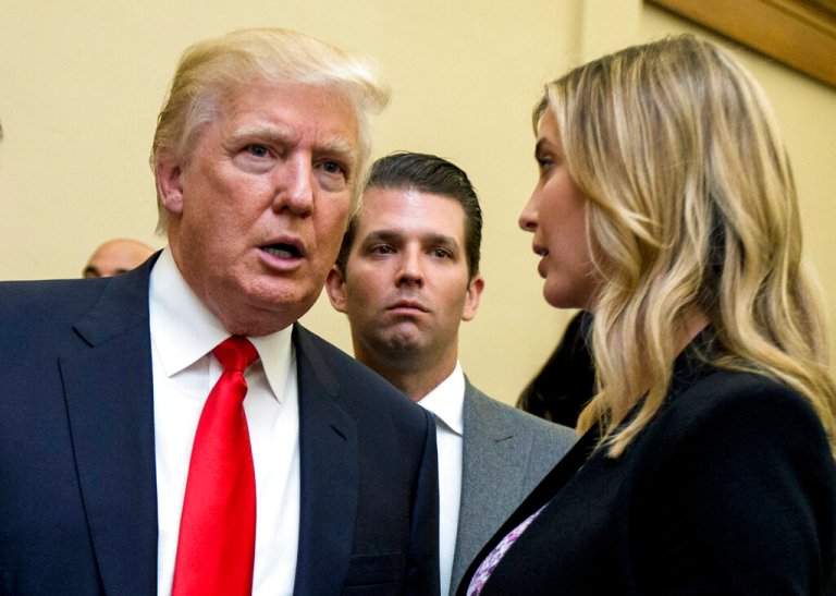 FILE - Donald Trump, left, Donald Trump Jr., center, and his daughter Ivanka Trump speak during the unveiling of the design for the Trump International Hotel in the The Old Post Office in Washington, on Sept. 10, 2013. In papers filed Monday, March 21, 2022, in a state appeals court, former President Trump's lawyers say a New York judge abused his discretion with a decision in February requiring the former president to answer questions under oath in a civil investigation into his business practices.