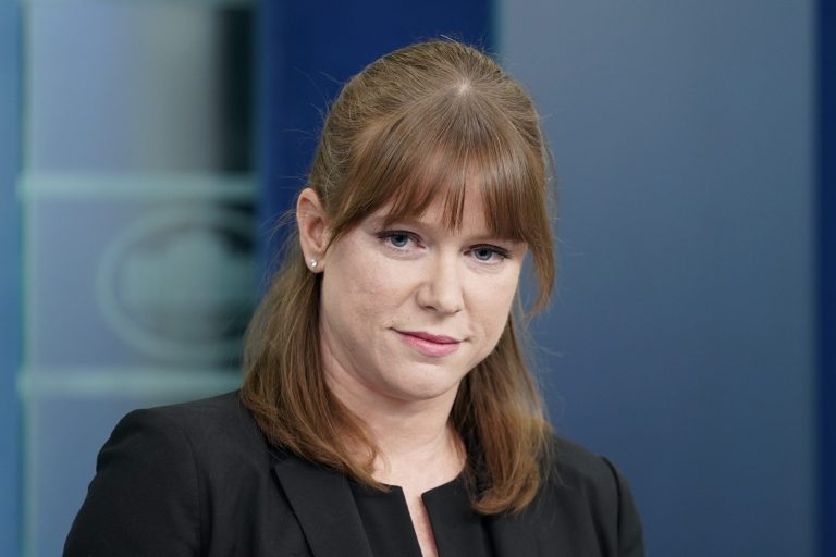 White House communications director Kate Bedingfield listens to a reporter's question during a press briefing at the White House, Tuesday, March 29, 2022, in Washington.