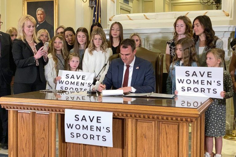 On March, 30, 2022, Oklahoma Gov. Kevin Stitt signed a bill that prevents transgender girls and women from competing on female sports teams.