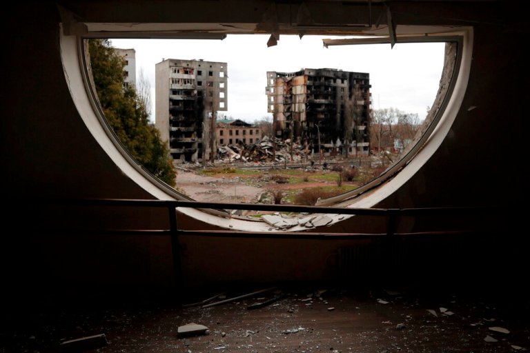 Glass and other debris litter the floor of a damaged performing arts building in Borodyanka, Ukraine, Wednesday.