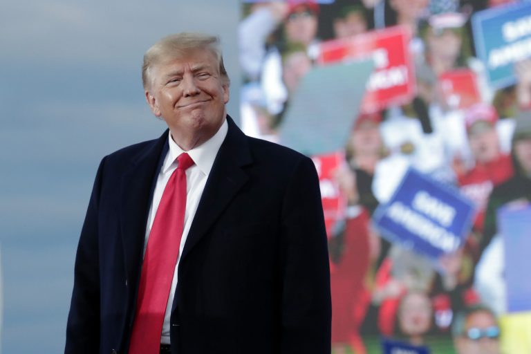 Former President Donald Trump smiles as he speaks at a rally, Saturday, April 9, 2022, in Selma, N.C. 