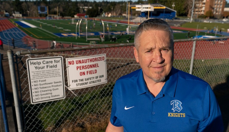 Joe Kennedy, a former assistant football coach at Bremerton High School in Bremerton, Washington, poses for a photo.