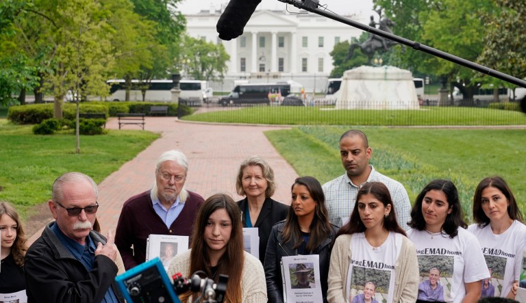 Joey Reed, fourth from left, father of U.S. Marine Corps veteran and recently released Russian prisoner Trevor Reed, speaks alongside his daughter Taylor Reed, center, near the White House on May 4.