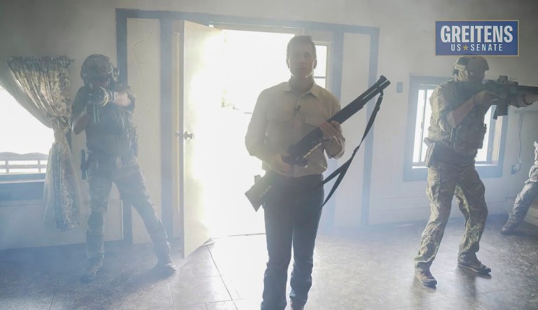 This image from video from a campaign ad by Eric Greitens for U.S. Senate, shows Eric Greitens, a Republican candidate for U.S. Senate in Missouri, in a campaign video ad that shows him brandishing a long gun and declaring that he's hunting RINOs, or Republicans In Name Only.