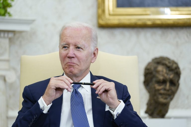 President Joe Biden listens as he meets with Mexican President Andres Manuel Lopez Obrador in the Oval Office of the White House in Washington, Tuesday, July 12, 2022.
