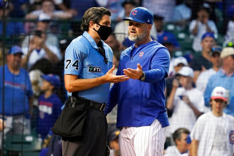 Chicago Cubs manager David Ross, right, argues with home plate umpire John Tumpane during the third inning in the second baseball game of the team's doubleheader against the New York Mets in Chicago, Saturday, July 16, 2022. 
