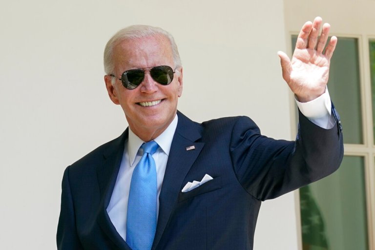 President Joe Biden waves after speaking in the Rose Garden.