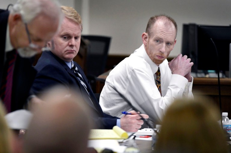 Chad Isaak, right, of Washburn, sits with his defense team during the third day of his murder trial at the Morton County Courthouse in Mandan, North Dakota, on Wednesday, Aug. 4, 2021.