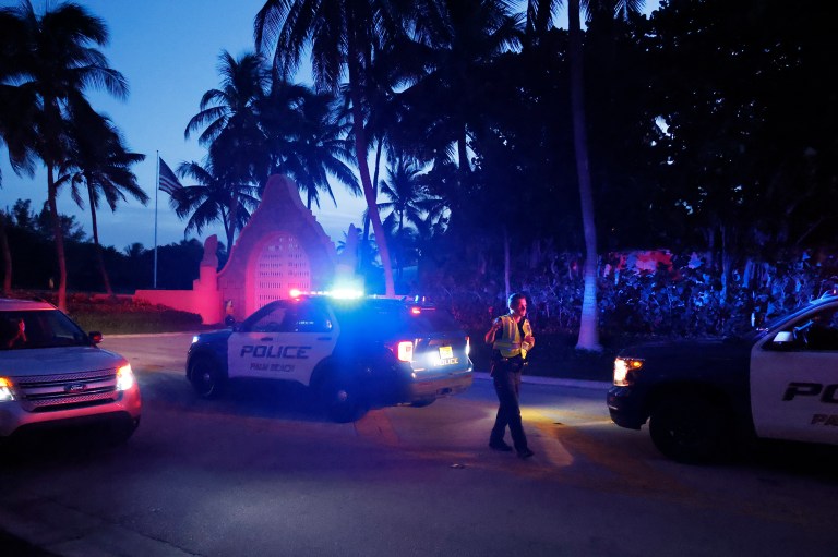Police direct traffic outside an entrance to Trump's Mar-a-Lago estate on Aug. 8.
