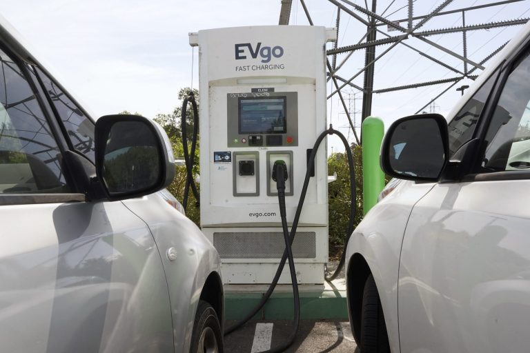 Electric cars are parked at a charging station in Sacramento, California, on April 13, 2022. 