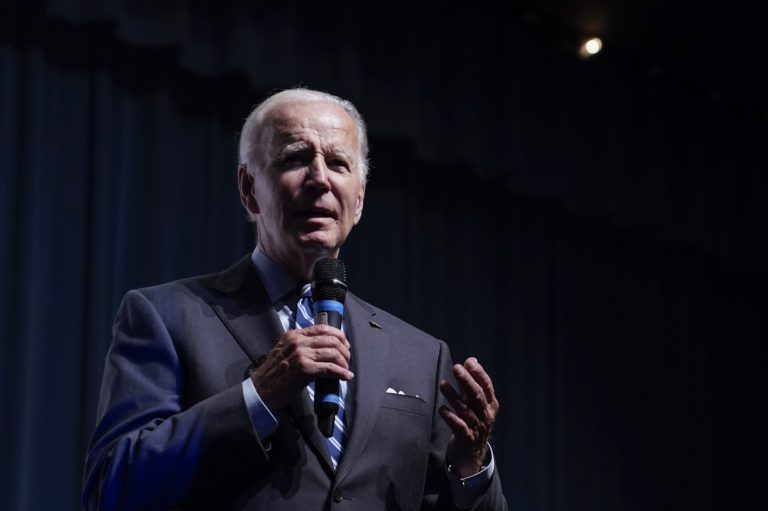 President Joe Biden speaks to a crowd in a overflow room at a rally hosted by the Democratic National Committee at Richard Montgomery High School, Thursday, Aug. 25, 2022, in Rockville, Md. 