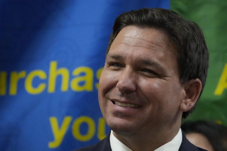 Florida Gov. Ron DeSantis smiles during a press conference on Sept. 7, 2022, in Miami. 