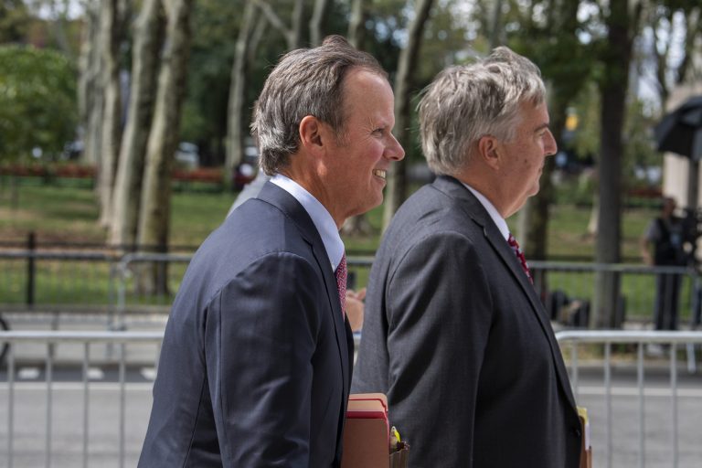 Donald Trump's attorneys Chris Kise and James Trusty arrive at Brooklyn Federal Court on Tuesday, Sept. 20, 2022, in New York. 