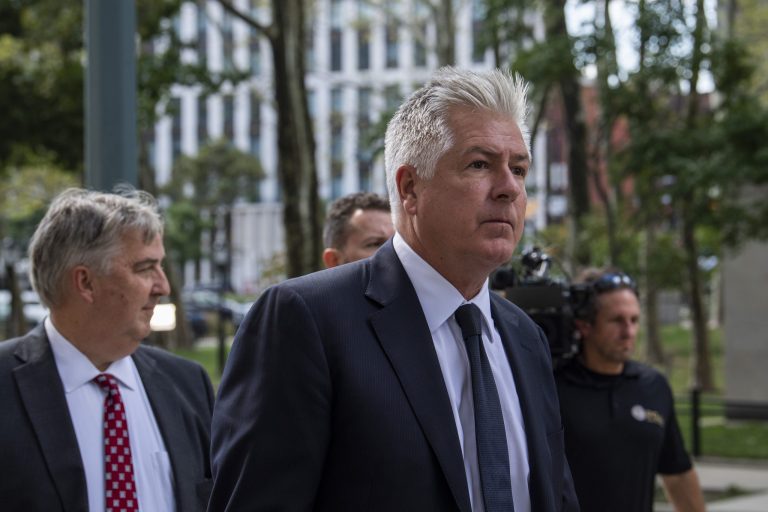 Donald Trump's attorney Evan Corcoran walk past media at Brooklyn Federal Court on Tuesday, Sept. 20, 2022, in New York. A judge ordered Corcoran to testify in the classified documents investigation in front of a grand jury on Friday.